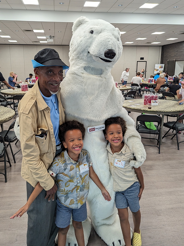 A grandfather, his two grandkids, and the Columbus Zoo's polar bear mascot.