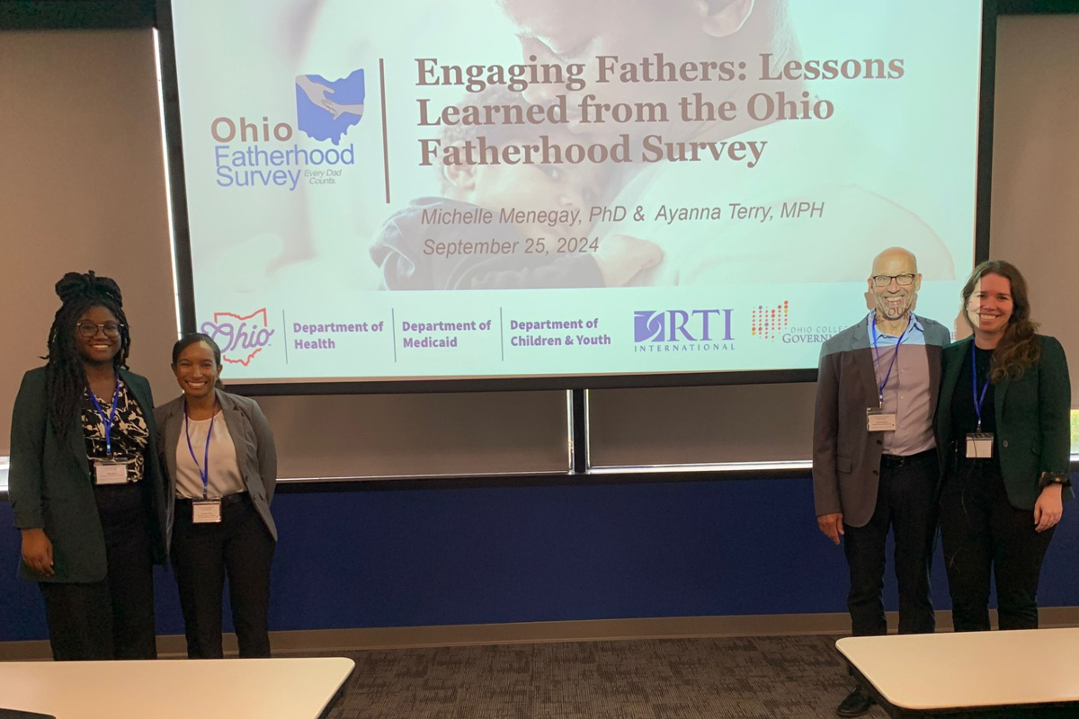 From left to right: Bria Oden, MPH of Ohio Department of Children and Youth, the GRC's Ayanna Terry, Steve Killpack of the Ohio practitioners' Network for Fathers and Families, and the GRC's Michelle Menegay.  They are flanking their presentation's title slide which is titled 'Engaging Fathers: Lessons Learned from the Ohio Fatherhood Survey'.