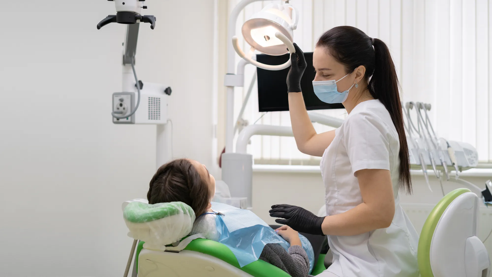 Image of a dentist examining a patient 