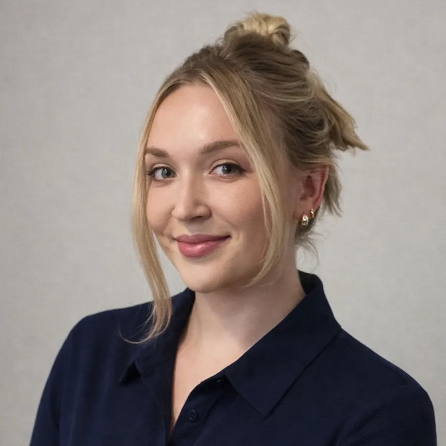 A blond woman wearing a black button up shirt